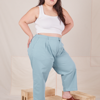 Angled view of Heavyweight Trousers in Baby Blue and vintage off-white Cropped Tank Top worn by Ashley