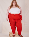 Catie is wearing Heavyweight Trousers in Mustang Red and Cropped Cami in vintage tee off-white