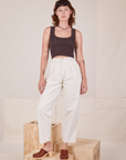 Alex is wearing Heavyweight Trousers in Vintage Tee Off-White and espresso brown Cropped Tank Top.