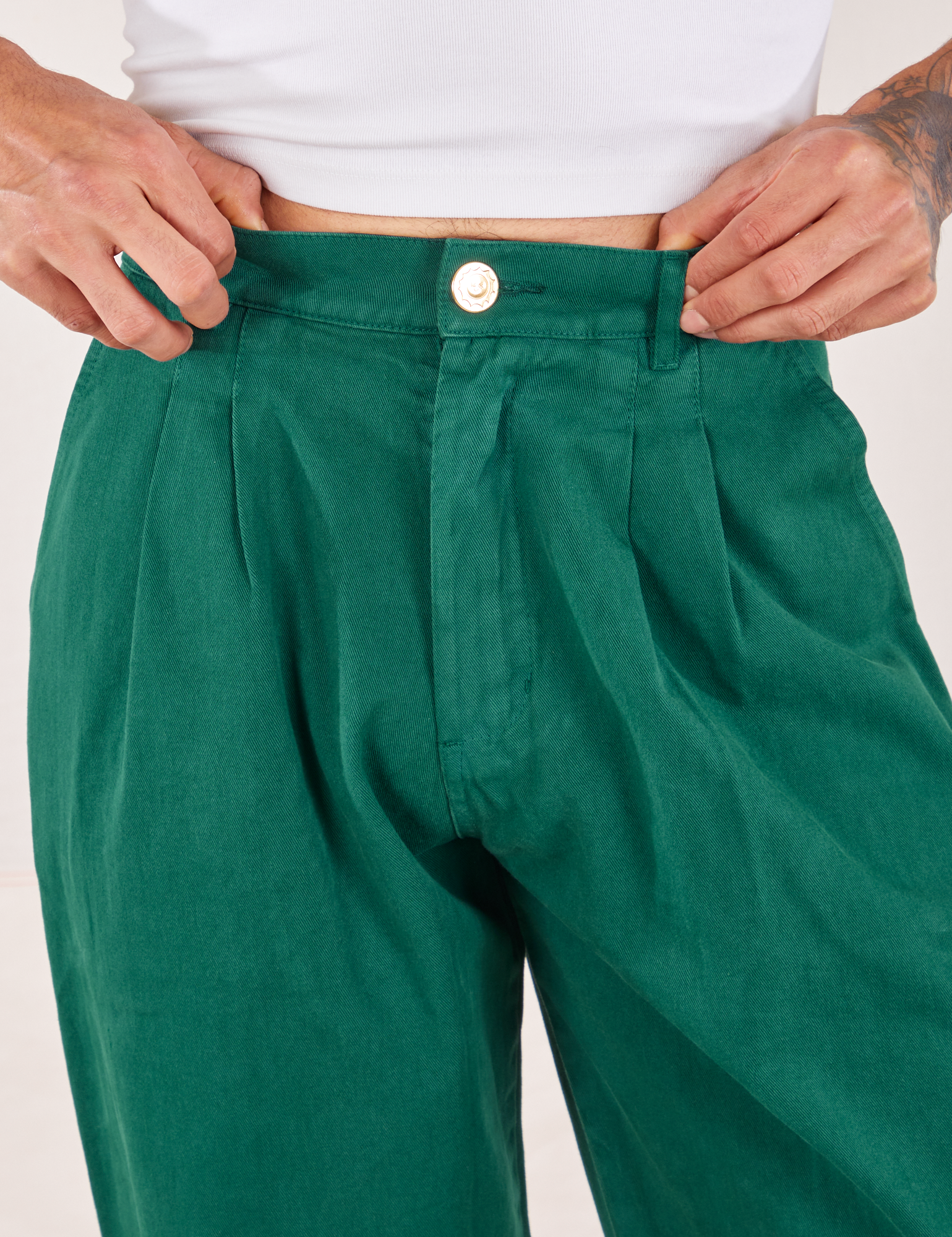 Front close up of Heavyweight Trousers in Hunter Green worn by Jesse