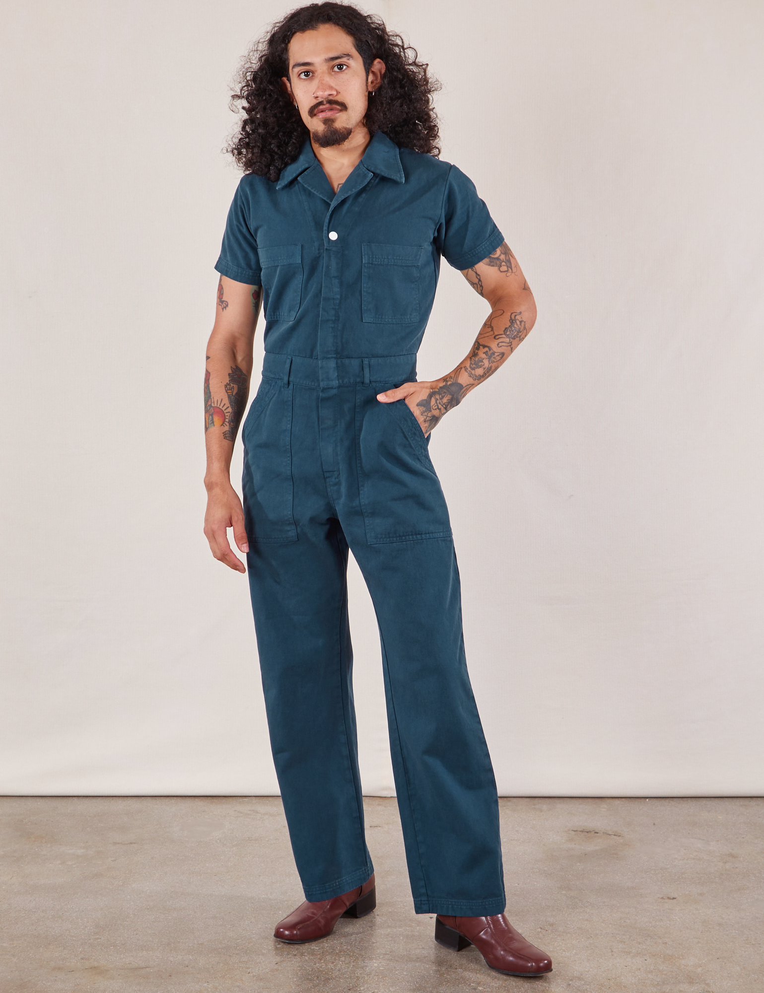Jesse is 5'8" and wearing S  Short Sleeve Jumpsuit in Lagoon