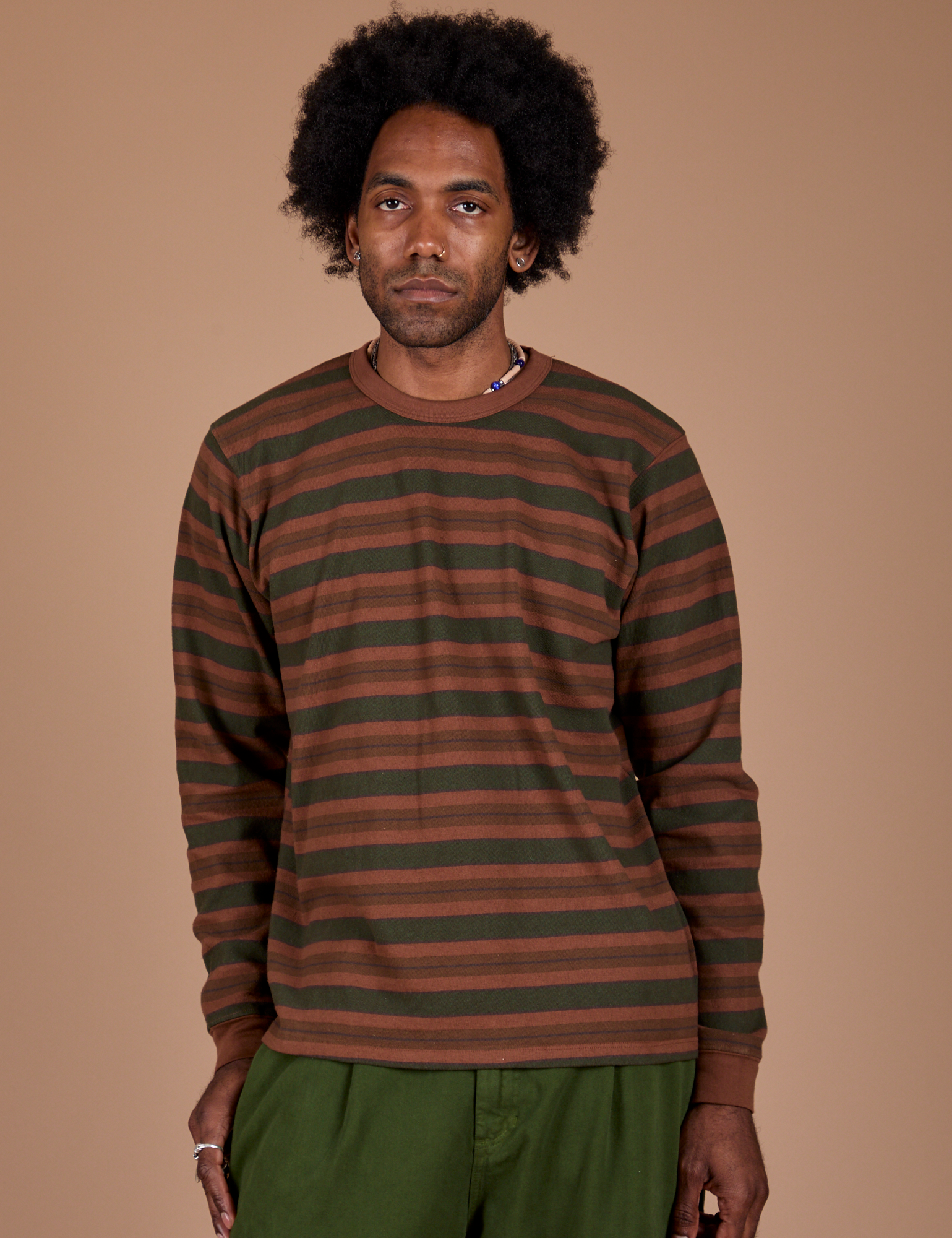 Jerrod is 6’3” and wearing M Long Sleeve Striped Burly Tee in Fudgesicle