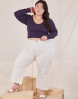 Ashley is wearing Long Sleeve V-Neck Tee in Nebula Purple and vintage tee off-white Petite Western Pants