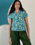 Shahana is 5’10 and wearing XS Angel Print Pantry Button-Up