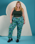 Juliet is wearing Work Pants in Angel Print paired with swamp green Cropped Tank