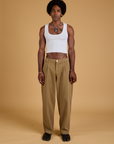 Jerrod is wearing Baggy Mid-Rise Trousers in Desert Brown and vintage tee white Cropped Tank