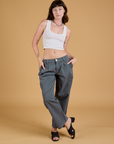 Alex is wearing Baggy Mid-Rise Trousers in Slate Grey and vintage tee white Cropped Tank