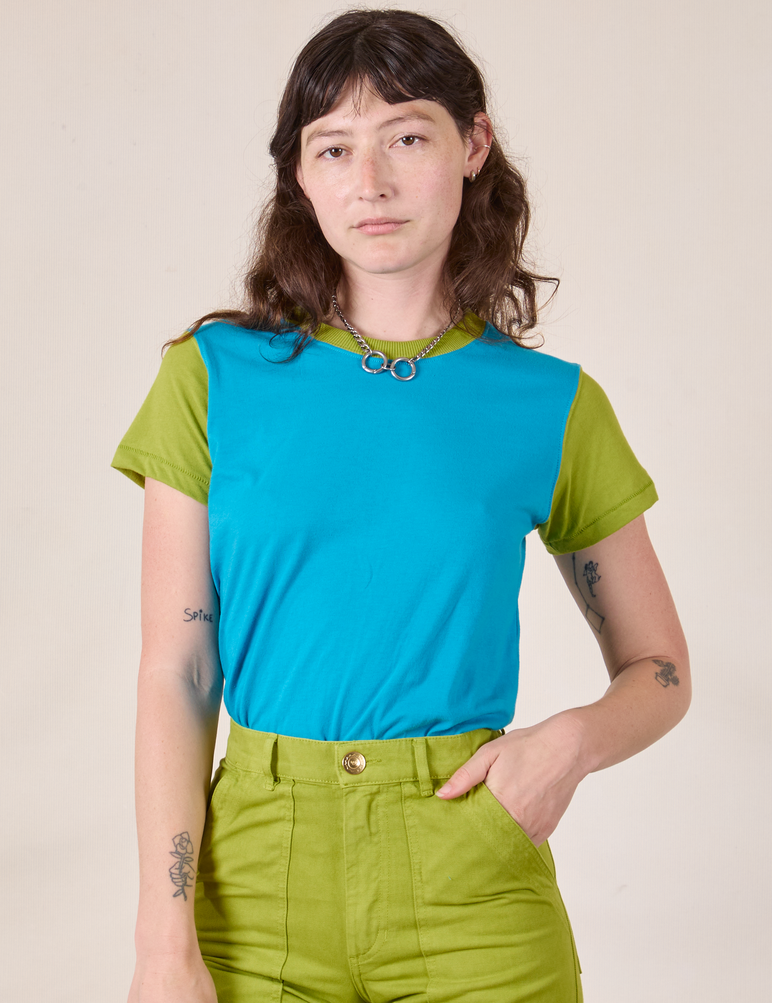 Alex is 5’8” and wearing P Mismatched Tee in Blue & Green