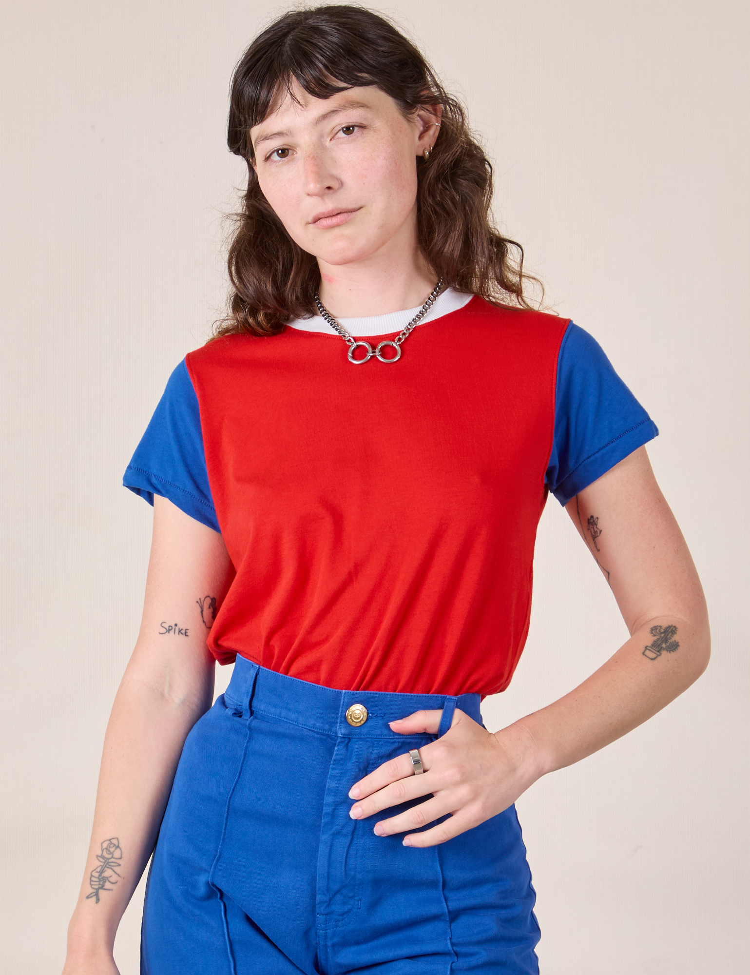 Alex is 5’8” and wearing P Mismatched Tee in Red & Blue