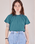 Hana is 5'3" and wearing P Organic Vintage Tee in Marine Blue tucked into light wash Carpenter Jeans