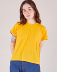 Hana is 5'3" and wearing P Organic Vintage Tee in Sunshine Yellow