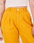 Front close up of Organic Trousers in Mustard Yellow on Alex