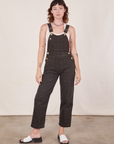 Alex is 5'8"and wearing size P Original Overalls in Mono Espresso with a Cropped Tank Top in vintage tee off-white