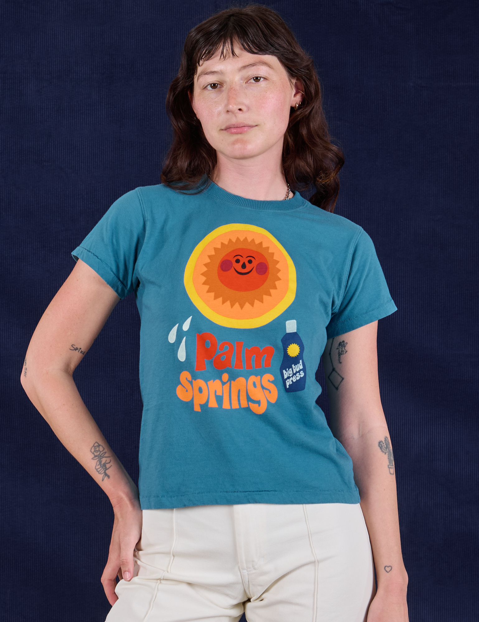 Alex is 5'8" and wearing P Palm Springs Tourist Tee