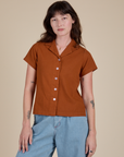 Alex is 5’8” and wearing P Pantry Button-Up in Burnt Terracotta