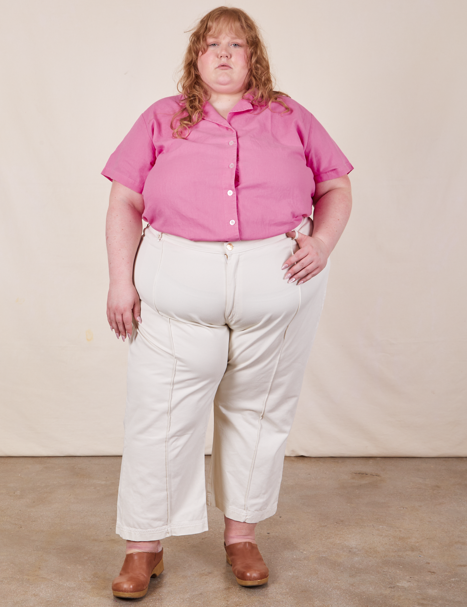 Catie is wearing Pantry Button-Up in Bubblegum Pink and vintage tee off-white Western Pants