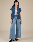 Alex is wearing Pantry Button-Up in French Blue and light wash Indigo Wide Leg Trousers