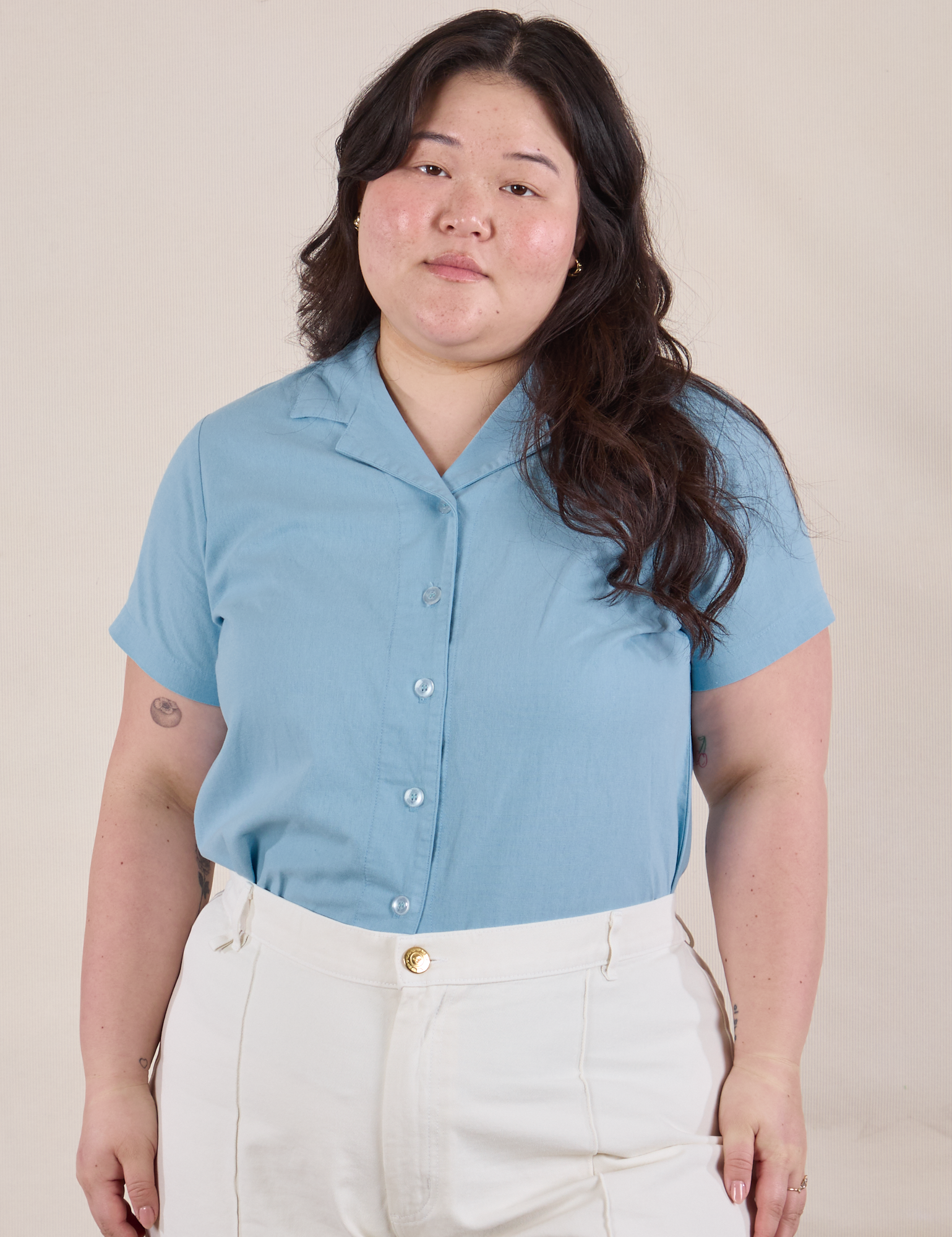 Ashley is 5'7" and wearing L Pantry Button-Up in Baby Blue