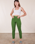 Alex is wearing Pencil Pants in Lawn Green and Cropped Tank Top in vintage tee off-white
