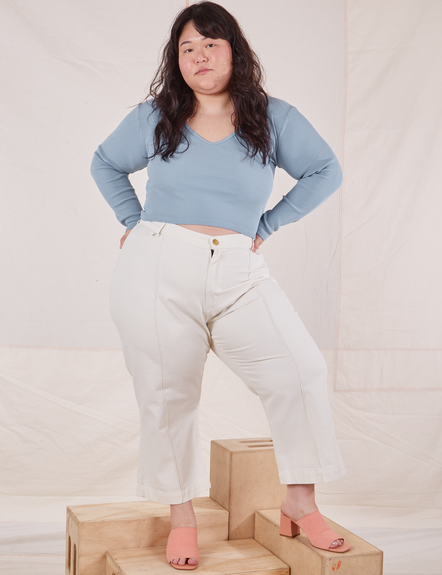 Ashley is wearing Long Sleeve V-Neck Tee in Periwinkle and vintage tee off-white Western Pants