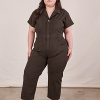 Ashley is 5’7” and wearing 1XL Petite Short Sleeve Jumpsuit in Espresso Brown