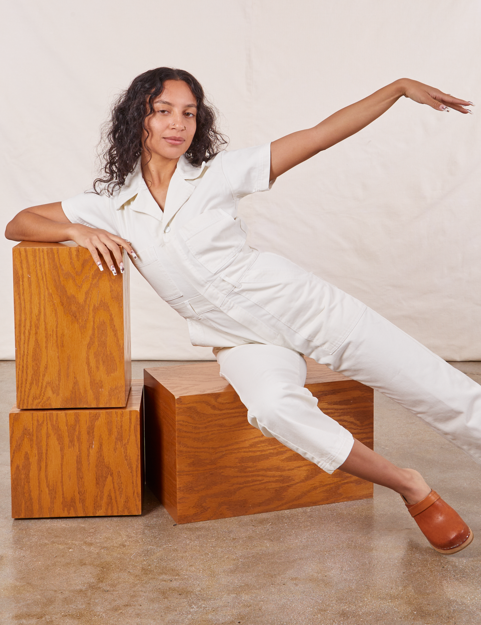 Blair is wearing Petite Short Sleeve Jumpsuit in vintage tee off-white