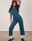 Kandia is wearing Petite Short Sleeve Jumpsuit in Lagoon