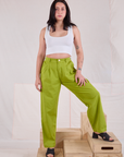 Betty is wearing Heavyweight Trousers in Gross Green and Cropped Tank in vintage tee off-white