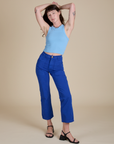Alex is wearing Racerback Tank in Baby Blue and royal blue Work Pants