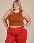 Juliet is wearing Racerback Tank in Burnt Terracotta