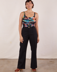 Tiara is wearing Cropped Cami in Rainbow Magic Waters and black Western Pants