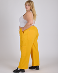 Side view of Drop Pocket Cargo Pants in Sunshine Yellow on Juliet