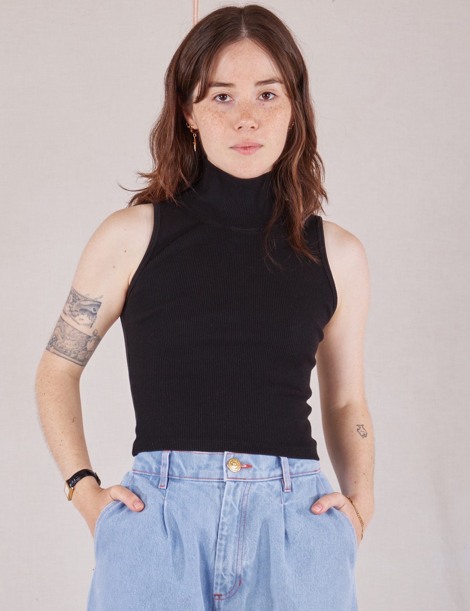 Hana is 5&#39;3&quot; and wearing P Sleeveless Essential Turtleneck in Basic Black