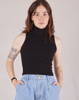 Hana is 5'3" and wearing P Sleeveless Essential Turtleneck in Basic Black