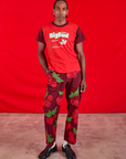 Jerrod is wearing Vintage Tee in Cherry Soda and Paintstamped Work Pants in Cherry