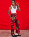 Side view of Paintstamped Work Pants in Cherry and Cropped Tank in vintage tee off-white on Jerrod