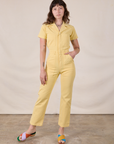 Alex is 5'8" and wearing XXS Short Sleeve Jumpsuit in Butter Yellow