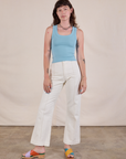 Alex is wearing Tank Top in Baby Blue paired with vintage tee off-white Western Pants