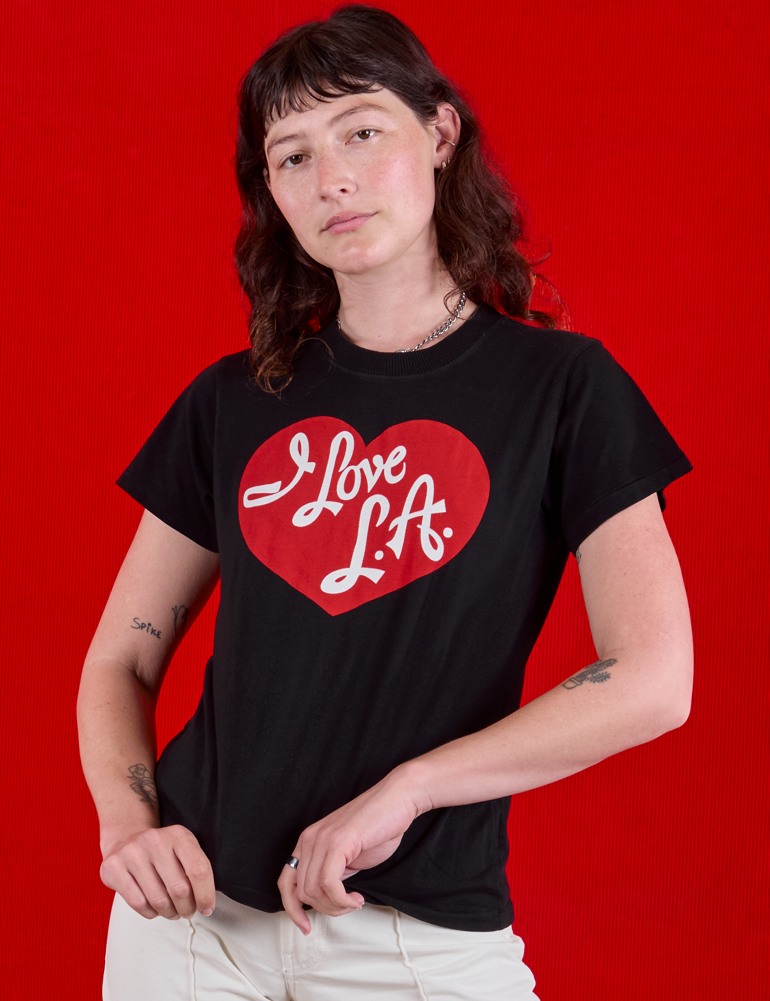 Alex is 5'8" and wearing P  I love LA Tourist Tee