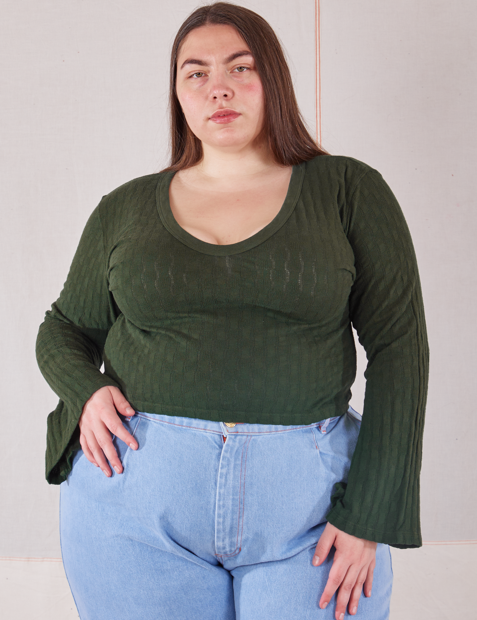 Marielena is 5'8" and wearing 1XL Bell Sleeve Top in Swamp Green