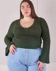 Marielena is 5'8" and wearing 1XL Bell Sleeve Top in Swamp Green