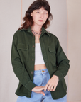 Alex is 5'8" and wearing P Flannel Overshirt in Swamp Green paired with vintage off-white Cropped Cami and light wash Trouser Jeans