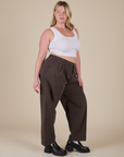 Angled front view of Heavyweight Trousers in Espresso Brown and vintage tee white Cropped Tank