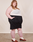 Side view of Trouser Shorts in Basic Black and vintage off-white Tank Top worn by Catie