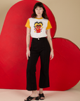 Alex is 5’8” and wearing P Vintage Tee in Devil Lovers paired with black Western Pants