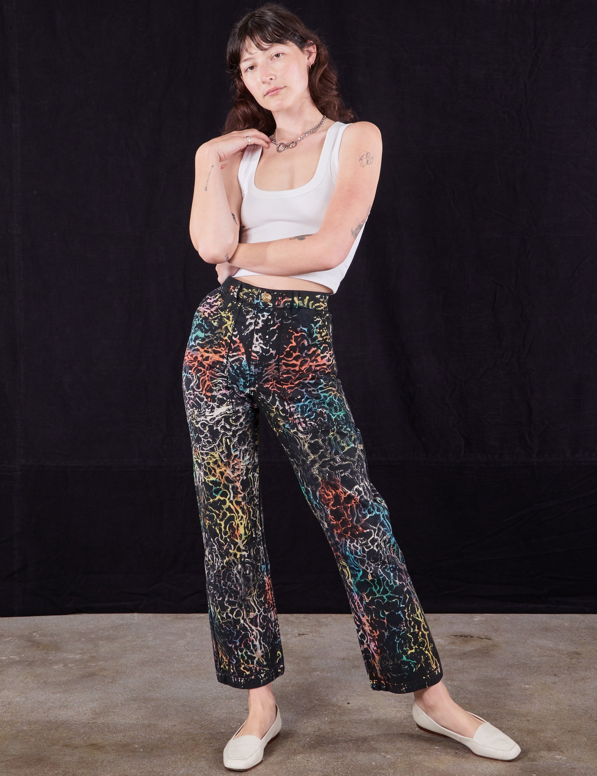 Alex is 5'8" and wearing XXS Wavy Dye Work Pants paired with a Cropped Tank in vintage tee off-white 