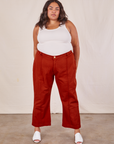 Alicia is wearing Western Pants in Paprika and a Tank Top in vintage tee off-white