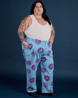 Angled front view of Floral Painted Work Pants in Blue and Tank Top in Vintage Tee Off-White on Sam