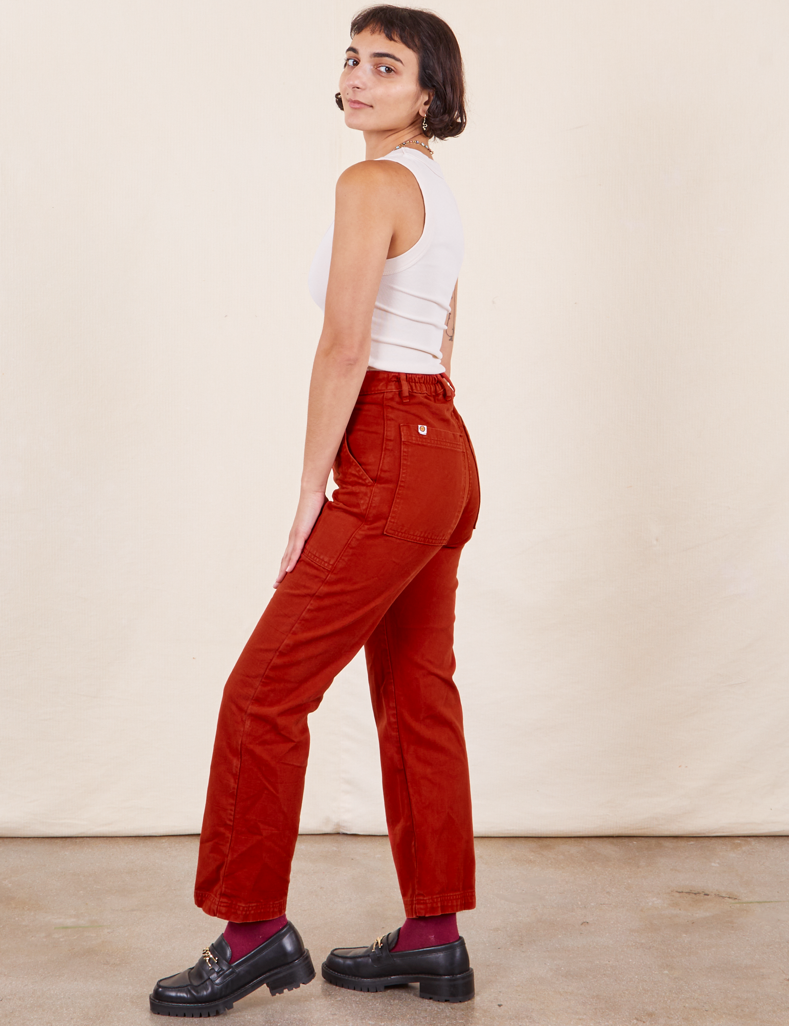 Work Pants in Paprika side view on Soraya wearing a Tank Top in vintage tee off-white