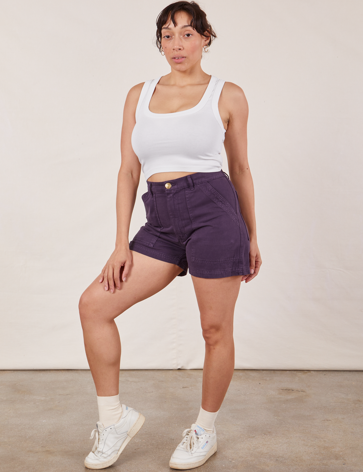 Angled front view of Classic Work Shorts in Nebula Purple and Cropped Tank Top in vintage tee off-white on Tiara